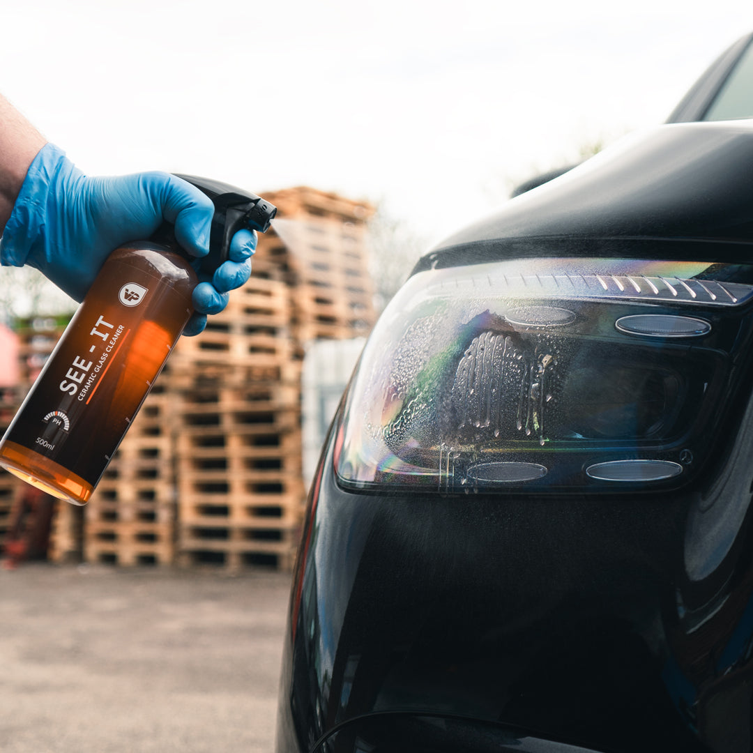 Ceramic glass cleaner getting sprayed onto headlight