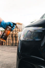 Ceramic glass cleaner getting sprayed onto headlight